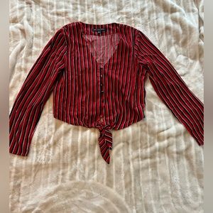 Red, white and blue long sleeve top. Short but not quite crop style